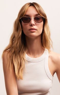 Bring runway fashion to your everyday look with the Catwalk. This smaller metal cat-eye frame makes a big statement and can elevate any outfit. Every frame comes with a collapsible case and cleaning cloth. All Z Supply Eyewear is polarized and provides 100% UVA, UBC & UVC protection so you can enjoy the sunshine! Shop All Z SUPPLY Eyewear Z SUPPLY Eyewear Women's Catwalk Sunglasses, Gold- Bronze Polarized Metal Cat, Lounge Bra, Enjoy The Sunshine, Heart Face Shape, Eyewear Womens, Cat Eye Glasses, Cat Eye Frames, Ankle Bones, Polarized Lenses