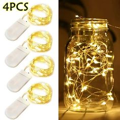 four lights in a mason jar with white wire