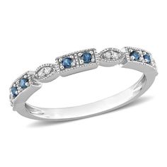 a white gold ring with blue and white diamonds