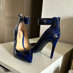 Brand New Never Worn Heels. Blue Snake Skin, Zip Up Back Blue Ankle Strap Heels For Evening, Chic Blue Ankle Strap Heels, Blue 4-inch Heels, Blue High Heel Shoes With Heel Strap, Blue High Heels With Heel Strap, Chic Blue Heels With Heel Strap, Blue Heels With 4-inch Heel For Night Out, Chic Blue Pointed Toe Heels, Blue High Heels With 4-inch Heel