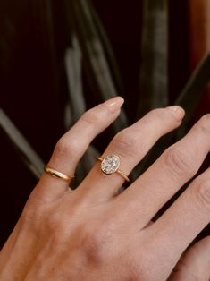 a woman's hand with a ring on it