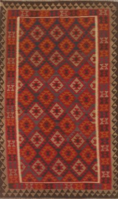 an old rug with red and grey colors