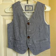 Brand New Boys Size 10 Blue And White Pin-Striped Button Down Vest. Cotton Button-up Vest With Buttons, Cotton Button-up Vest, Casual Cotton Vest With Snap Buttons, White Button-up Vest, White Button-up Vest With Button Closure, Spring Cotton Vest With Buttons, Blue Button-up Cotton Vest, Fitted Cotton Outerwear For School, White Cotton Vest With Buttons