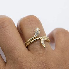 "3/4\" CZ Snake with Pink Eyes Ring Solid Real 10K Yellow Gold Size 7.5 * Metal : Real 10K Yellow Gold (Properly Stamped, 10K)  * Condition : Brand New  * Finish : Polished  * Average Weight : 3.76 grams  * Length : Size 7.5  * Width : 19mm x 5mm = 3/4\" x 3/16\"  * Clasp/Bail : Can be resized down or up at your local jeweler. All of our items are brand new and are shipped with a gift box." Gold Snake Ring With Diamond Accents As Gift, Gold Snake Ring With Diamond Accents, Gold Snake Ring With Diamond Accents For Gift, Gold Snake Ring With Diamond Accents For Anniversary, Yellow Gold Snake Ring With Diamond Accents For Gift, Adjustable 14k Gold Snake Ring For Anniversary, Eyes Ring, Snake Ring Gold, Cats Eye Ring