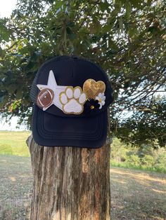 ❤️Create your own custom sports trucker hat. Choose your sport, colors, number or initials (minimum of 2 numbers or letters). ❤️ Please message us before purchasing to ensure that we have the patches that you want. Once we have discussed details just purchase the listing and leave the major details in the personalization box at checkout. I will send pictures in Etsy messages for your approval before we press the hat. We will work together to make sure that we have created a hat that you will love!  ❤️Hats will include 3-4 medium patches (hearts, stars, paw prints, tiger heads, numbers, letters, sports patches) and 1-2 smaller patches for fillers (hearts, flowers, stars, lightning bolts, butterflies, etc.) Hats chains are also available for an additional charge.  ❤️Free Shipping on orders o One Size Trucker Hat With Visor For Sports Events, Customizable Black Trucker Hat For Sports, Customizable Black Sports Hat, Customizable Black Snapback Hat For Sports Events, Customizable Black Snapback Hat For Sports, Customizable Black Trucker Hat For Sports Events, Team Spirit Trucker Hat Snapback, Customizable Black Baseball Cap For Sports, Customizable Black Trucker Hat For Baseball Season