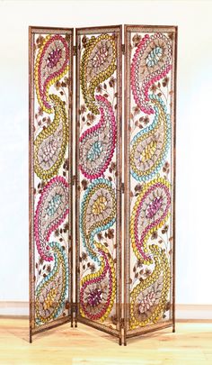 a room divider with colorful designs on it