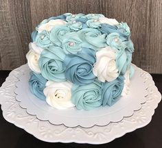 a cake with blue and white flowers on it