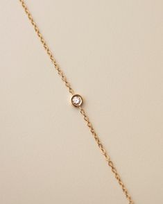 Dainty 14k gold birthstone bracelet!Looking for a minimal way to show off your birthstone, your children's birthstones, or a significant other?Personalize this chain bracelet with your choice of birthstone.Made with 14k solid gold and 2mm lab created birthstones. Available in 14k Yellow gold, and white gold * Leave us your choice of birthstone in the comment box at checkout.•• January—Garnet •• February—Amethyst •• March—Aquamarine •• April—White sapphire •• May—Emerald •• June—Alexandrite •• Ju Gold Birthstone Bracelet, Bracelets Simple, Bracelet Diamond, Birthstone Bracelet, Belly Chain, Birthstone Bracelets, Delicate Chain, Blue Zircon, Diamond Bracelets