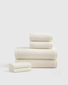 three white towels stacked on top of each other