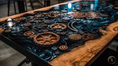 a wooden table topped with lots of gears