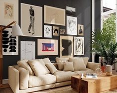 a living room filled with furniture and lots of pictures on the wall above it's coffee table