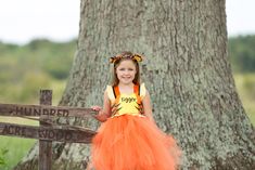 How cute is this Tigger dress!! Oh so cute!!! Perfect for Halloween,dress up, birthdays,and special events! This dress is made knee length,you dont have to leave a measurement,but if you choose to please leave a measurement from armpit to desired length. Checkout our shop for our Winnie the Pooh,and Piglet Design!!! Ears are NOT included but can be added on from the drop down menu.(Ears may vary in style depending on stock) Exclusive Design to Pink Toes & Hair Bows Themed Dresses For Halloween Events, Themed Halloween Dresses, Cute Halloween Dress-up Costumes, Themed Dress-up Dresses For Halloween, Themed Halloween Dress-up Dresses, Cute Tutu Dress For Halloween Costume, Cute Halloween Costume Tutu Dress, Fun Halloween Costume Dress, Fitted Playful Costume Tutu Dress