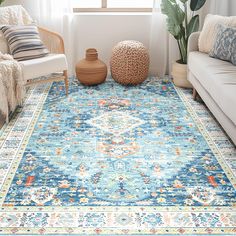 a living room area with couches and rugs