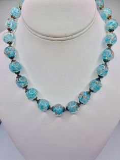 - Vintage blue Murano glass beaded necklace - Beautiful blue glass with with gold accents  - 16 inch necklace  - Gold tone metal shows some slight discoloration due to age  - Overall clean and in good condition  K 2872 Light Blue Single Strand Necklace With Round Beads, Blue Czech Glass Jewelry With Large Beads, Vintage Blue Glass Necklace, Vintage Blue Glass Jewelry, Vintage Blue Glass Beads, Vintage Blue Beaded Necklaces With Spacer Beads, Blue Glass Faceted Beads, Blue Faceted Glass Beads, Adjustable Blue Glass Beaded Necklaces