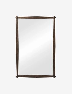 a wooden frame mirror on a white background with the reflection of an object in it