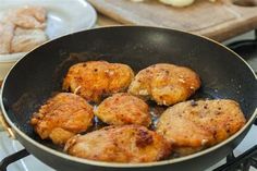 some food is cooking in a frying pan on the stove top and ready to be cooked