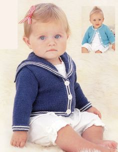 a baby wearing a blue sweater and white shorts