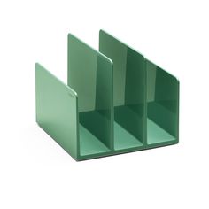 three green bookshelves sitting side by side on a white surface with no one in the photo