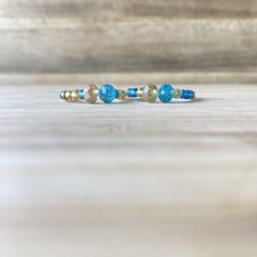 These beautiful rings, will make you look expensive, whilst also being on a budget😉. Handmade out of 0.8mm transparent elastic string, gold and blue seed beads and crystal beads. Make sure to select your ring size and your option, in the sections above.  💖Check out our other ring collections: https://www.etsy.com/shop/Zooheela?ref=seller-platform-mcnav&section_id=48579398 ABOUT DELIVERY: Shipment time might vary, depending on where you live; however, we place a huge importance on the delivery Blue Birthstone Beaded Bracelets, Blue Beaded Bracelets With Birthstone, Adjustable Birthstone Jewelry Band, Dainty Blue Rondelle Jewelry, Blue Spiritual Stackable Jewelry, Blue Stackable Jewelry With Round Beads, Blue Faceted Beads Bangle Jewelry, Blue Faceted Bead Bangle, Blue Bangle With Faceted Beads