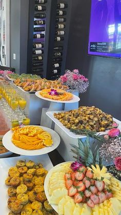 a buffet filled with lots of different types of food and drinks on plates next to each other