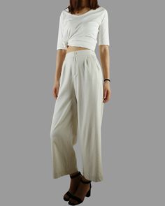 * A wide leg cropped linen pants, with cropped length, two pockets, fixed waist on front and elastic waist on back. * Material: 50% linen, 50% cotton Custom made to fit, lead time is 6-8 days; Let us know your usual size in your country and your overall height. If you have some specific request or special characters such as broad shoulder, long arms, long waist, etc you think we need pay attention to when making, do let me know. * Colors: 1. Beige 2. White 3. Black 4. Khaki 5. Coffee * Shop sizi Dark Green Skirt, Elastic Waist Trousers, Linen Drawstring Pants, Cropped Linen Pants, Pants Elastic Waist, Pants Summer, Winter Skirt, Wide Leg Linen Pants, Summer Pants