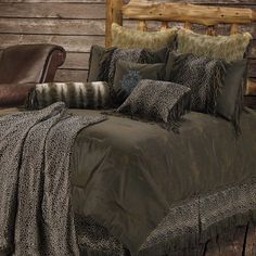 an image of a bed with pillows and blankets