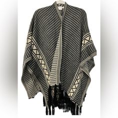 Nwt Francesca’s Fringed Wrap Shawl Black & Cream Geometric Pattern **Reversible *Size - One Size *Colors - Black & Beige/Tan Excellent Piece To Throw On Heading Out The Door Or A Night On The Town! Traditional Black Cape For Fall, Black Shawl Poncho One Size, Black Bohemian Shawl For Fall, Black Bohemian Poncho With Batwing Sleeves, Traditional Black One-size Poncho, Bohemian Black Winter Wrap, Black Bohemian Wraps For Winter, Winter Bohemian Black Wrap, Black Poncho With Batwing Sleeve One Size