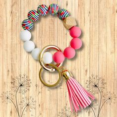 These ADORABLE bangle keychains are perfect for the girl who's always got her hands full! Pair with any of our planners! Small-sized tassels Vibrant colors Cute and pretty wristlet gift for any mom or girl High quality silicone Multiple vibrant colors and trendy styles Dimensions: 3" inside bracelet (Elastic) 4" outside bracelet 2" tassel Girls High, The Girl Who, Key Rings, Tassel Necklace, Trendy Fashion, Bangles, Vibrant Colors, Beaded Bracelets, Personalized Items