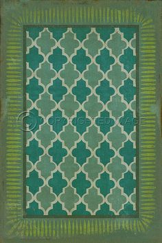 a green and white rug with an ornate design on it's border, in the middle