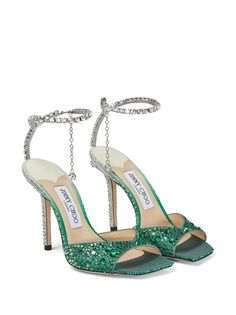 Saeda 100mm crystal-strap sandals These Saeda sandals are imbued with Jimmy Choo's glamorous flair. Sculpted from leather in a gradient design, they're covered with crystals and finished with a jeweled ankle strap, creating a captivating interplay of light. Made in Italy Highlights ~emerald green ~silver-tone ~calf leather ~gradient effect ~crystal embellishment ~crystal-embellished ankle strap ~square open toe ~branded leather insole ~high stiletto heel Jimmy Choo Saeda 100, Jimmy Choo Saeda, Jimmy Choo Sandals, Verde Smeraldo, Jeweled Shoes, Crystal Sandals, Crystal Shoes, Satin Pumps, Embellished Sandals