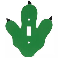 a green light switch cover with black horns