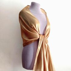 A magnificent organza shawl with a rough effect. Beautiful beige color with a precious golden shine. The golden beige shawl or bolero is made of high-quality organza with a beautiful shine. Evening cape and shawl for the mother of the bride, bridesmaids. It will gently cover your shoulders on a summer evening or in the spring. Length approximately 200 cm Width approximately 48 cm Color rendering may differ depending on monitor settings. Due to the sensitive nature of the veiled item this is a final sale and cannot be returned, but if you have any questions please contact me and I will resolve the issues. Luxury Gold Shawl For Eid, Elegant Gold Silk Scarf For Evening, Elegant Gold Scarves For Formal Occasions, Elegant Gold Formal Scarves, Elegant Gold Silk Scarf, Formal Gold Silk Scarf, Elegant Gold Scarf For Evening, Elegant Beige Wrap Scarf, Elegant Beige Scarf Wrap