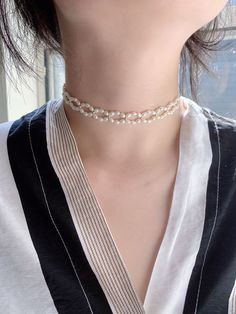 This pearl choker is made with tiny freshwater pearls. The tiny beads and spring rings are all made with 14K gold filled which is sensitive skin-friendly and guarantee long lasting wear. All of the freshwater pearls we picked are AAA luster. Also the necklace will come with a 2inches extender. Every Necklace will come with a jewelry box. 💗Material💗 Bead: 3mm-3.5mm Freshwater pearl, 2.5mm Gold filled bead Spring ring: 14K gold filled Extension chain: 2 inches/14K gold filled. one 6.5-7mm freshw Delicate Pearl Beaded Choker, Delicate Pearl Jewelry With Tiny Beads, Dainty Pearl White Pearl Choker, Dainty Pearl Choker With Pearl Charm, Dainty Pearl Chain Choker, Delicate Tiny Beads Pearl Necklace For Wedding, Delicate Pearl White Pearl Choker, Delicate Pearl Choker With Charm, Dainty Pearl Choker With Pearl Chain