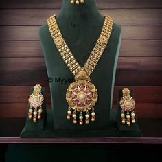 Finest quality antique finish micro gold necklace set with earring and mangtika. This beautiful gold replica chandan haar is made with premium quality gems in ruby and green color with beautiful diamond details in earring.  All orders Ship same day if placed before 4:00 PM EST  Earring Length: 3.5 inch Earring Width: 1.25 inch Mangtika length: 4.5 inch Pendant length: 4 inch Pendant width: 2.75 inch Necklace Length:  26 inch adjustable with dori closure.  Create beautiful memory for any occasion Antique Gold Kundan Necklace For Wedding, Ornate Brass Kundan Necklace For Wedding, Antique Kundan Necklace For Wedding And Festive Occasions, Antique Kundan Bridal Necklace For Wedding, Antique Kundan Jewelry Sets For Wedding, Antique Kundan Chandbali Necklace For Wedding, Antique Chandbali Kundan Necklace For Wedding, Traditional Antique Gold Kundan Necklace For Wedding, Antique Chandbali Bridal Necklace For Wedding