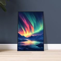 an art print of the aurora bore over mountains and water in front of a blue wall