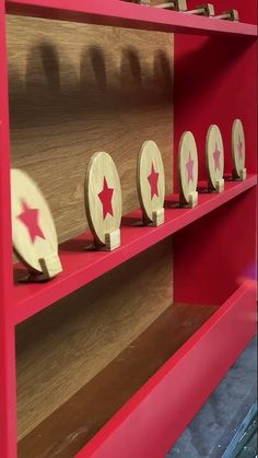 several wooden stars are placed on the shelf