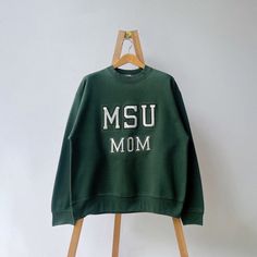 90s Michigan State University MSU Spartans sweatshirt/ L * PLEASE READ BEFORE PURCHASE * PLEASE consider the PHOTOS before making the decision * The images may DIFFER in appearance from the actual product because we took pictures under daylight.  * PLEASE send your PHONE NUMBER after your purchase for the shipping company to contact you X No returns X No refund Condition : 9/10 More details : look at the pictures  Brand : Fruit of the loom Size on tag : L Pit to pit/ Chests : 24/48 inches  Length : 28 inches  Material : cotton polyester  Color : green  * ALL ITEMS are VINTAGE which may show some signs of wear and tear * Due to the different display and different light, the picture may not reflect the actual color of the item Thank you RE/18/10/23 College Green Fleece Sweatshirt, 90s Fleece Sweatshirt For Fall, 90s Green Cotton Sweatshirt, 90s Style Green Cotton Sweatshirt, Msu Spartans, Michigan State University, Shipping Company, Michigan State, The Loom