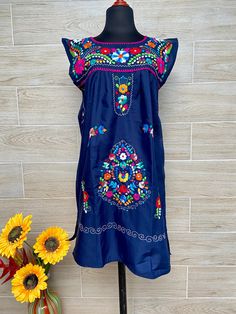 Mexican dress, ethnic dress, embroidered dress, cool dress, multicolored embroidered dress, dress of Oaxaca. Each dress has a unique embroidery. This dress is made with poplin fabric 90% polyester, 10% cotton. Mexican textile art has centuries of history and creativity throughout the country. Mexico is recognized as one of the leading countries with a beautiful aristic production in the textile world, miraculous hands of talented artisans from different states of the country create stunning embr Blanket Dress, Mexican Sandals, Mexican Textiles, Mexican Dress, Vintage Cowboy Boots, Sassy Pants, Unique Embroidery, Mexican Dresses, Ethnic Dress