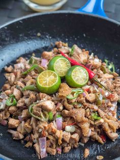 chicken stir fry with limes and onions in a skillet