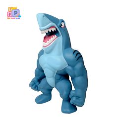 a toy shark with its mouth open and it's teeth wide open, on a white background