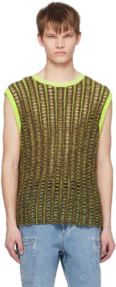 a young man wearing a green and black knitted top with an openwork pattern