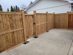 a wooden fence in front of a house