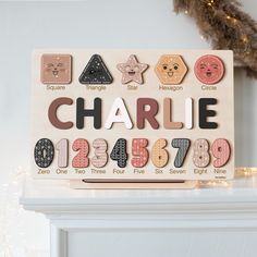 a personalized wooden name sign with different shapes and numbers for children's rooms