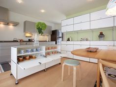 the kitchen is clean and ready to be used for cooking or dining room purposess