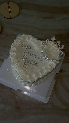 a heart shaped cake sitting on top of a table