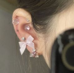 a close up of a person with ear piercings