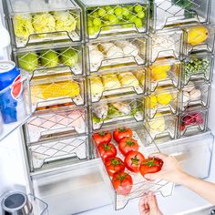 the refrigerator door is open to show fresh fruits and vegetables