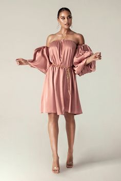 Our 'Ella' Satin dress is so fun and flirtatious, making it perfect for romantic days. Made from our lustrous soft satin in a pretty rose hue. It has a balconette neckline to the bodice with a free waist that makes you feel comfortable and elegant at the same time. Dramatic sleeves have to be exaggerated to look more attractive. This dress is fully lined as you'd expect from us. Wear yours with our 'Farah Chain Belt'. Puff Sleeve Satin Dress, Dupioni Silk Dress, Champagne Bars, Dramatic Sleeves, Tailored Skirt, Dinner Dates, Pretty Rose, Romantic Dinner, Dress Dusty