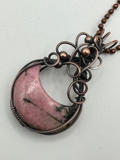 Pink Rhodonite Crescent Moon pendant wrapped in oxidized copper wire to give it an antique look. Pendant is 2 inches tall and 1.25 inches wide. Comes with a free 18 inch chain! Wire Jewelry Rings, Pink Rhodonite, Wire Jewelry Making