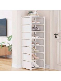 a white shoe rack in the corner of a room